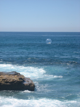 The bubble out on the water is actually a piece of sculpture from "Scuplture by the Sea" This is an annual event in Sydney, worth coming to Australia for! Check out the website gallery of the exhibition. 
http://www.sculpturebythesea.com/