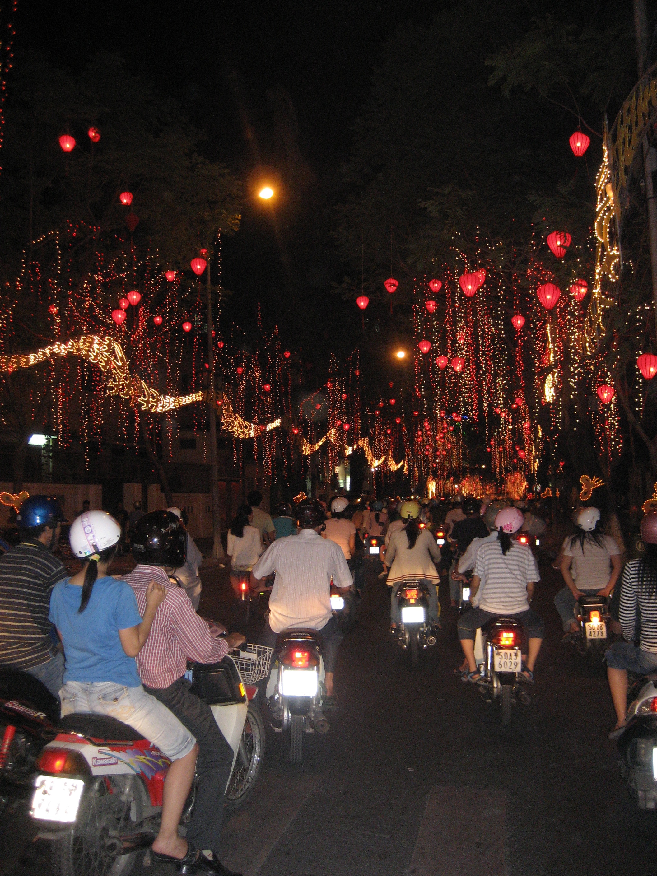 This photo was taken from the back of a motor bike in Saigon (Ho Chi Minh City) Vietnam. Chinese New Year, or Tet as it is known in V/N is a sight to behold. A fantastic time of celebration for young and old and perfectly safe wherever you go 24/7. Another place certainly worth a visit.  