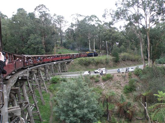 going "round the bend." Notice the cars parked with people out waving. They had family members on the train, and played tag with it all along the way, driving ahead to stop at each place the train crossed the road to wave.