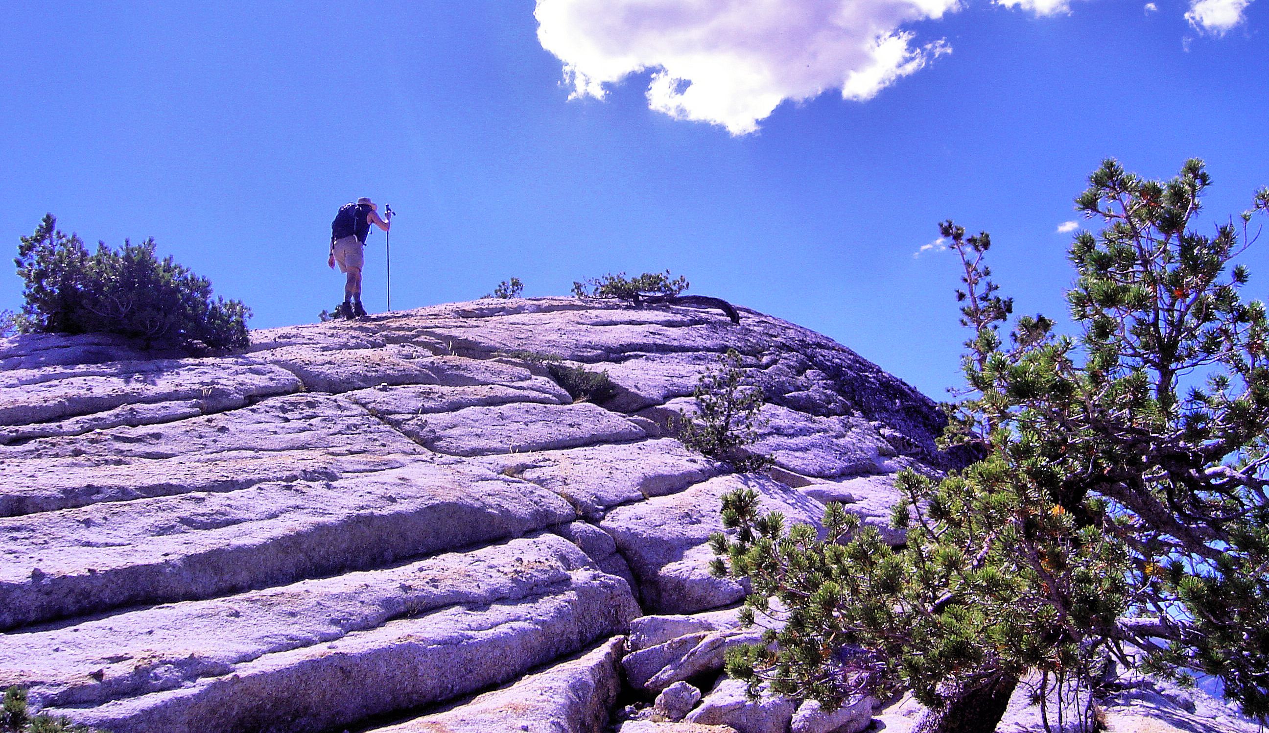 Hiking up a dome over Tuolumne Meadows.