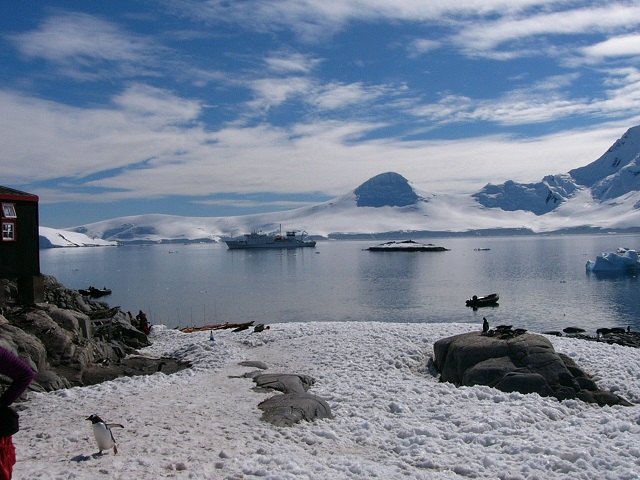 The tranquil setting of the harbour at Port Lockroy with our ship and a Zodiac in sight.