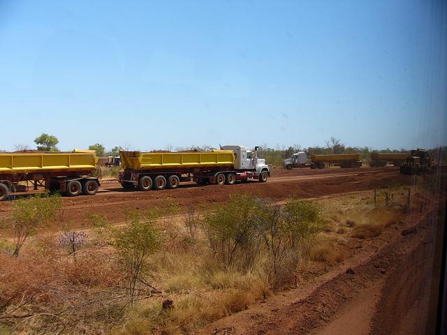 A couple of trucks getting the roads ready before the wet season