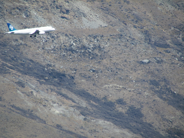 The planes seem to be very close to the mountain slopes