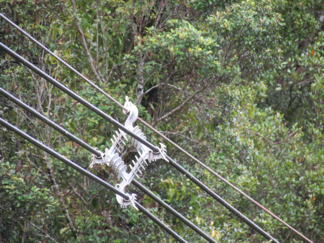 On some roads the sides are so steep that the power lines are separated by spacers.