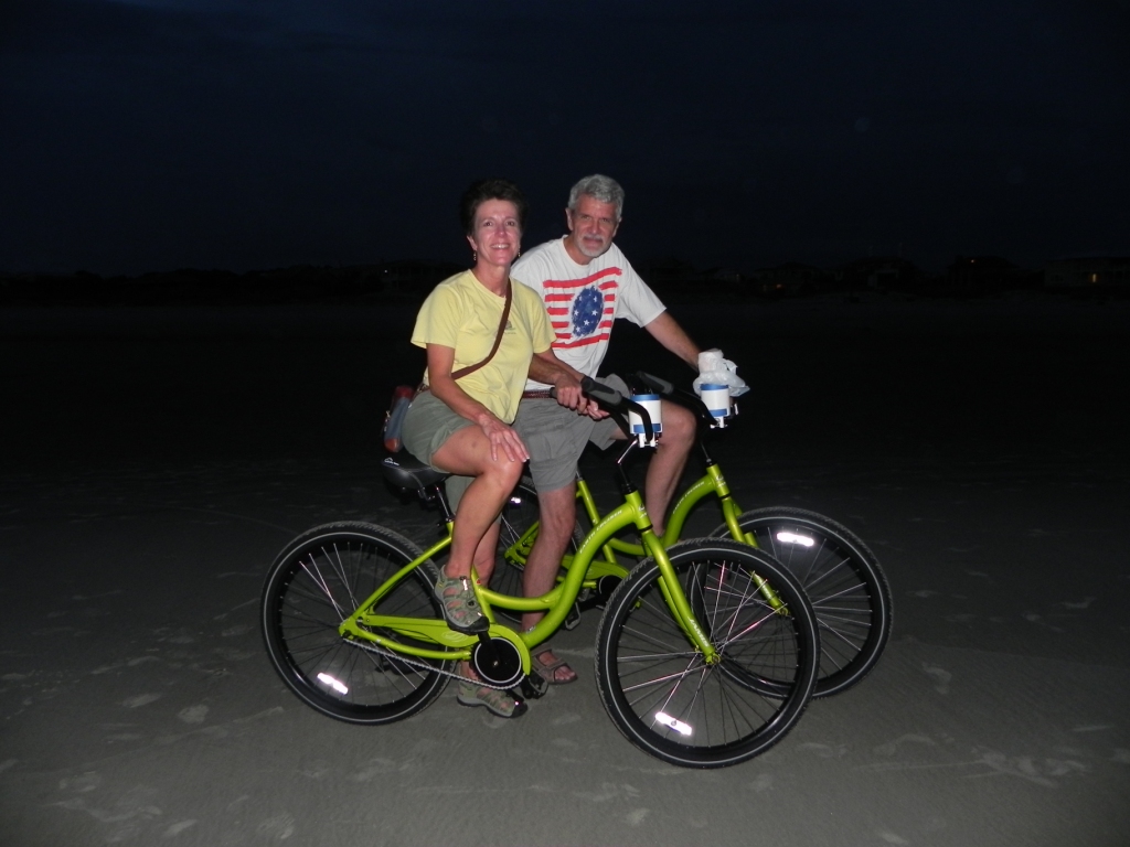 Biking on the beach at night.