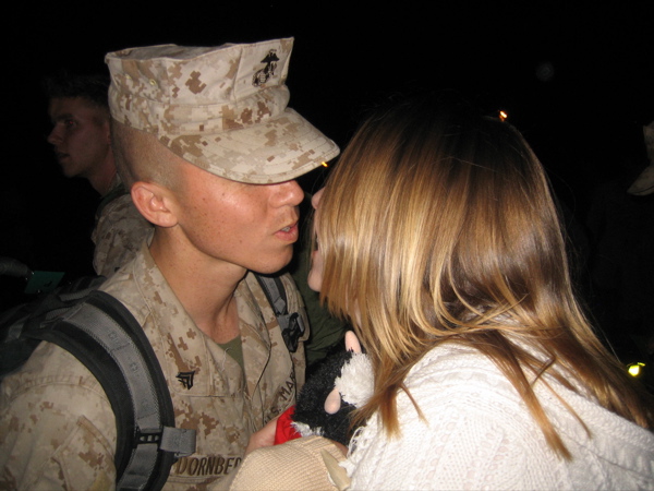 Yuji's homecoming after second deployment.  First time meeting his son, Brandon (the little beige knit cap at bottom)